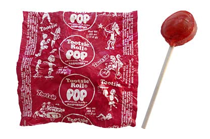 Assortit individually wrapped red raspberry Tootsie Pops ready for distribution