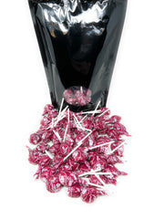 Assortit Tootsie Pops arranged in a jar at a party offering vibrant decoration