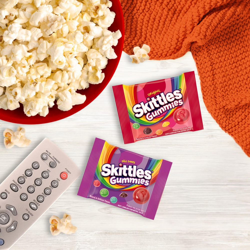 Assortit Skittles fun-size packs scattered highlighting convenient portioning