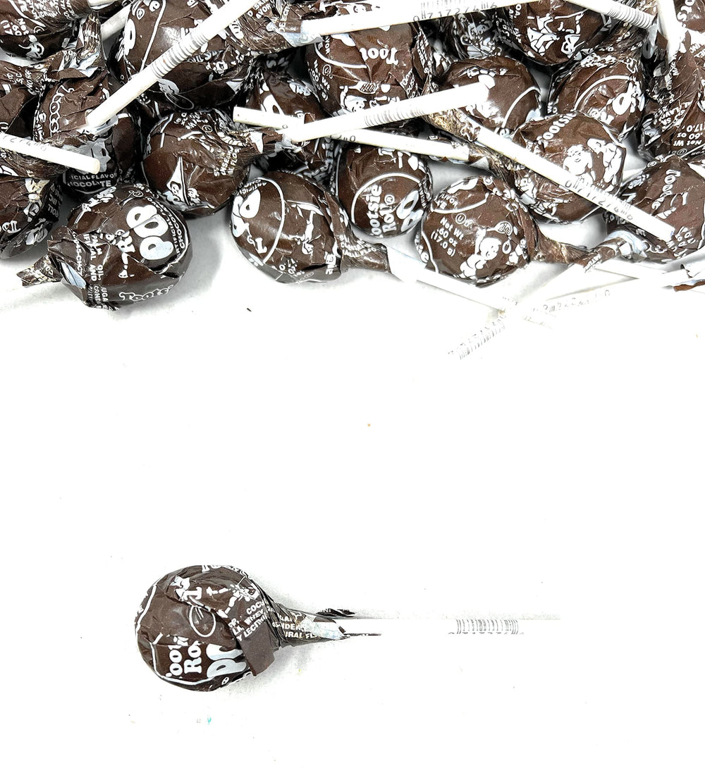 Assortit lollipop next to ruler for size and scale clarity