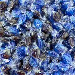 Assortit candy close-up texture highlighting smooth hard surface and concentrated flavor