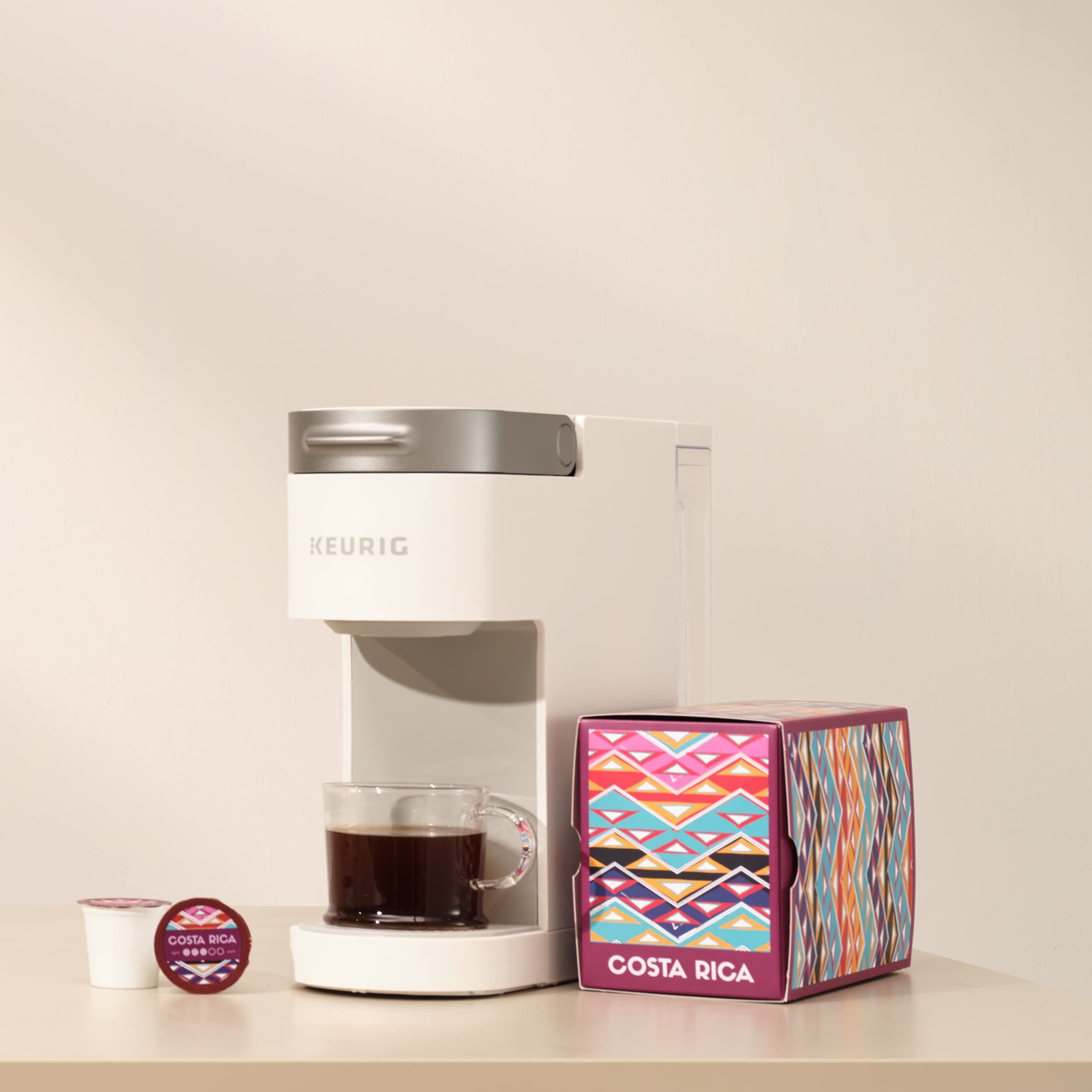 Atlas Coffee Club pack beside common objects showing 24-count size benefit