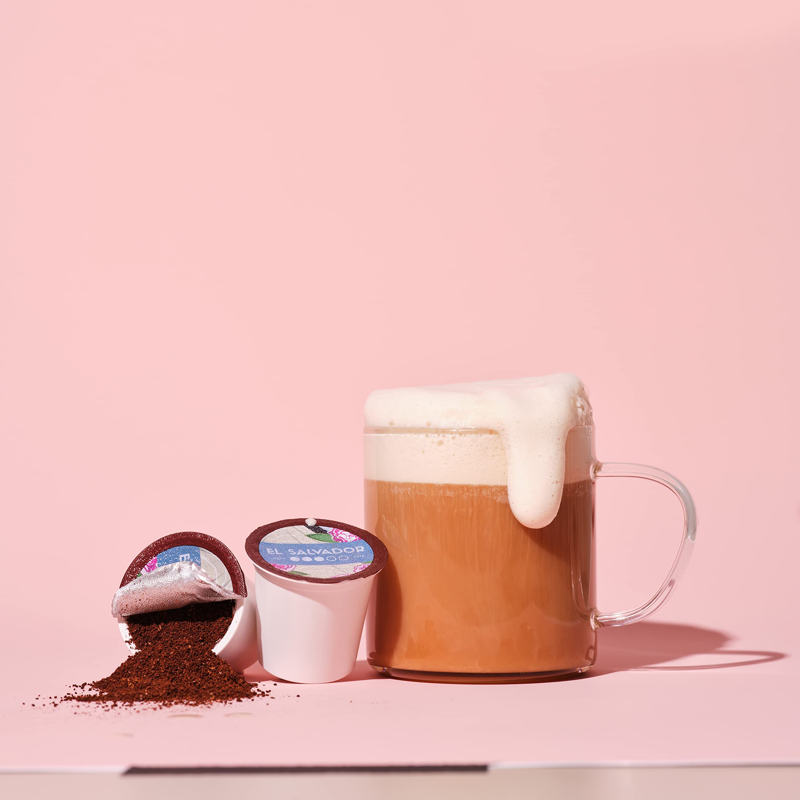 Atlas Coffee Club pod held in hand to show size and convenient single-serve benefit