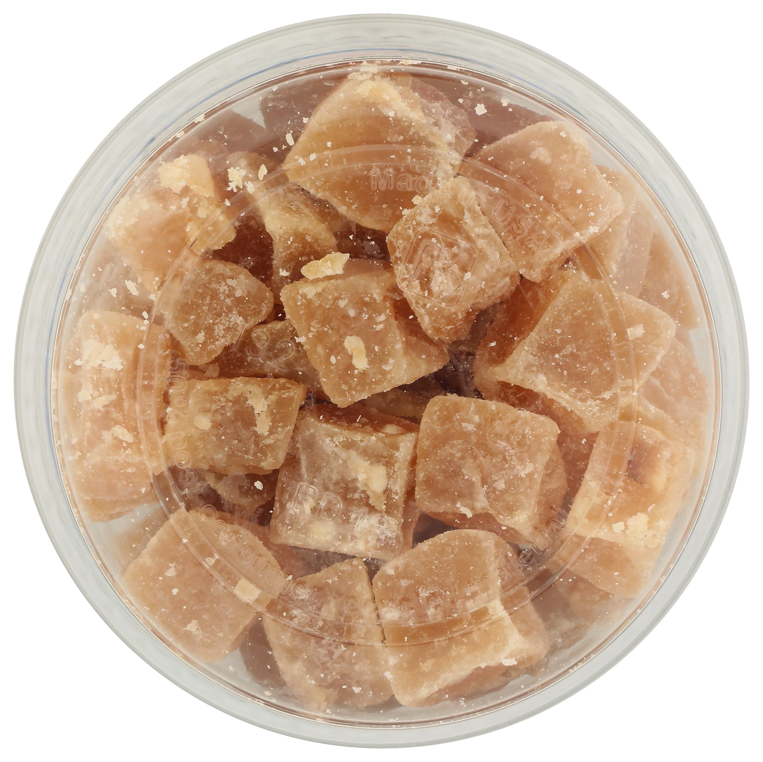 AURORA crystallized ginger beside a cup of tea suggesting comforting pairing