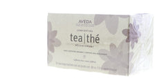 Aveda single sachet unwrapped beside teabag demonstrating portability and freshness