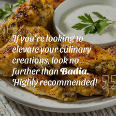 Badia garam masala sprinkled in curry pot, adding warm flavor and fragrance