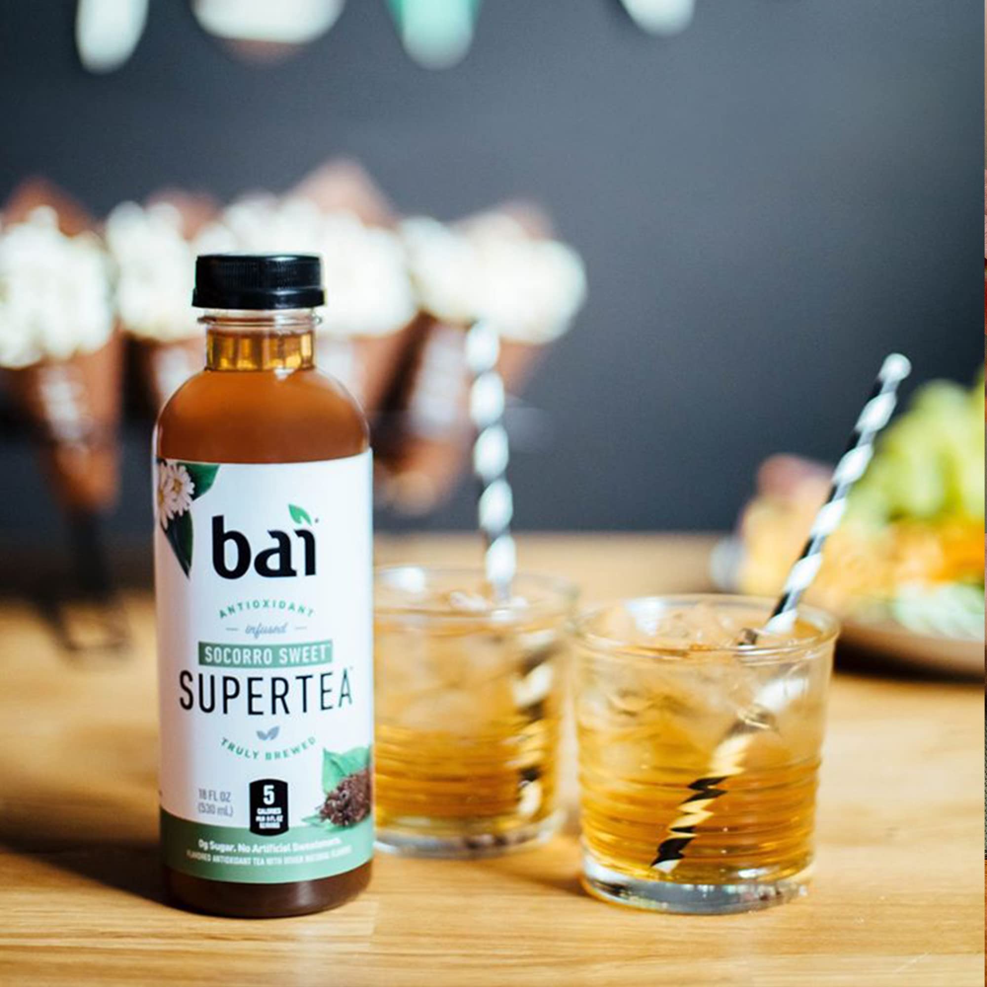 Bai Socorro Sweet held in hand for scale showing 18 fl oz serving size