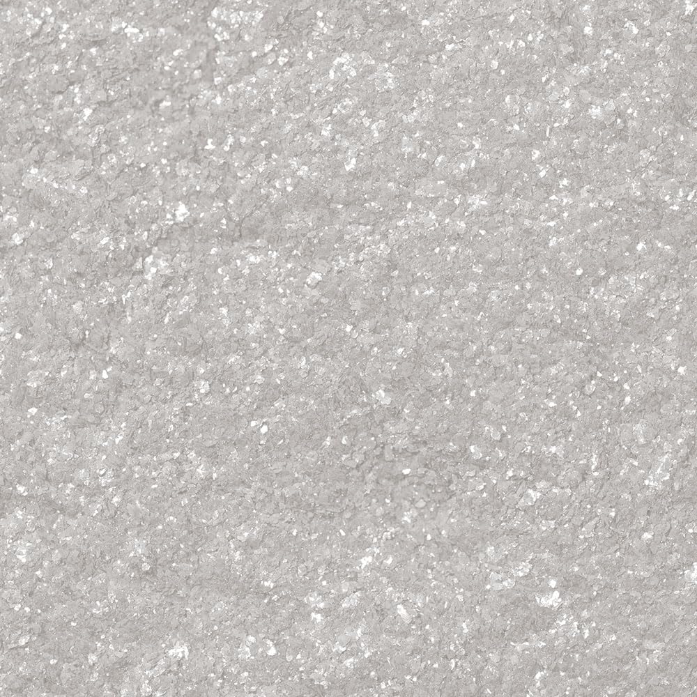 Bakell dust accenting cake edge to add pearly finish and defined decoration