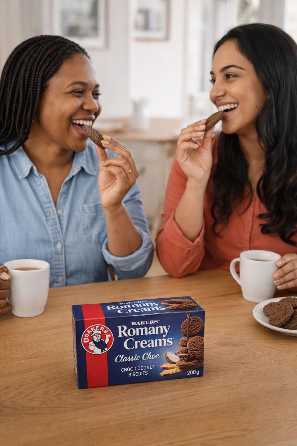 BAKERS Romany Creams cookie held in hand showing size and convenient snack benefit