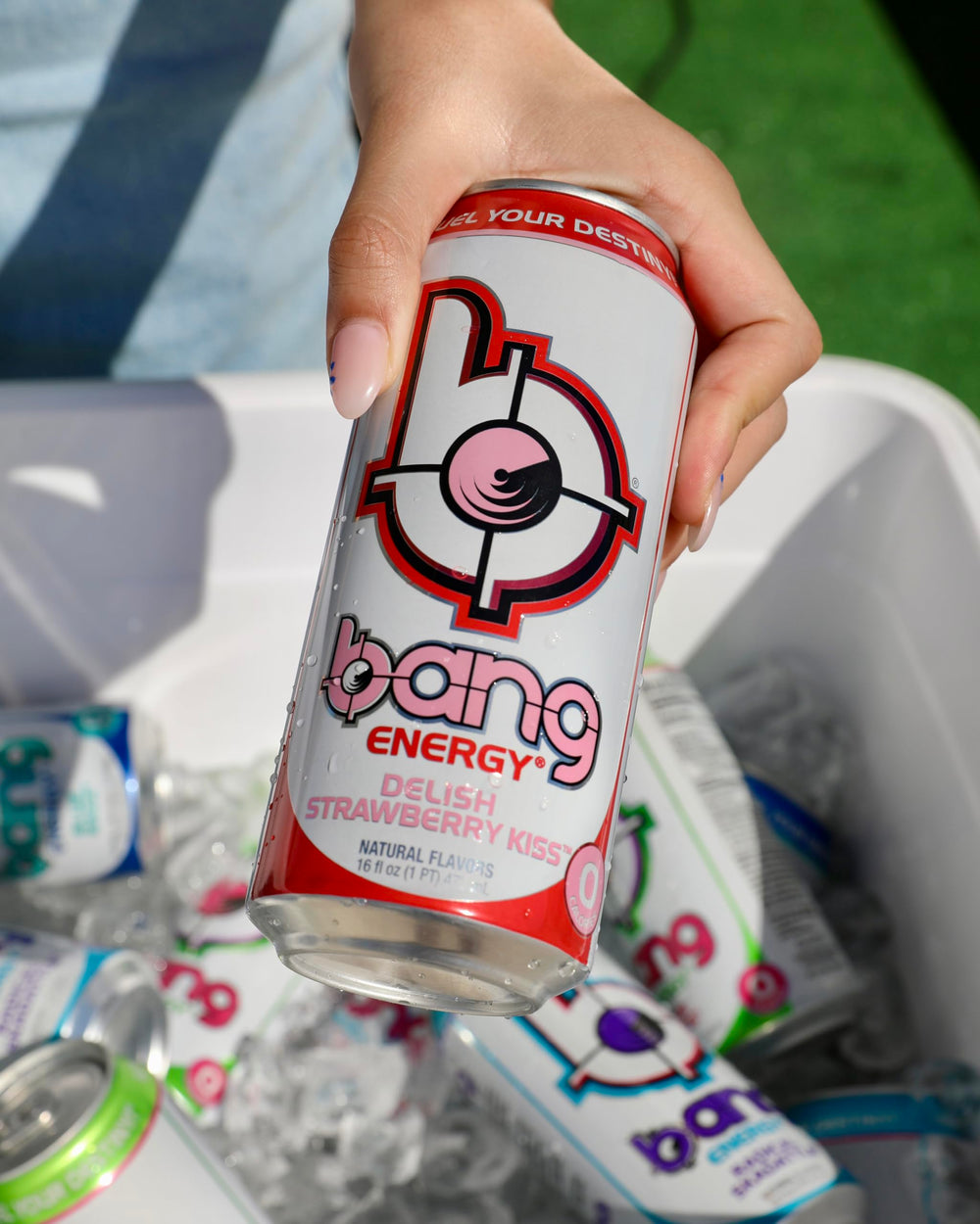 BANG Delish Strawberry Kiss can beside gym gear, demonstrates energy boost for workouts