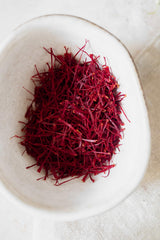 banu saffron tea infusion with threads releasing aroma and golden color