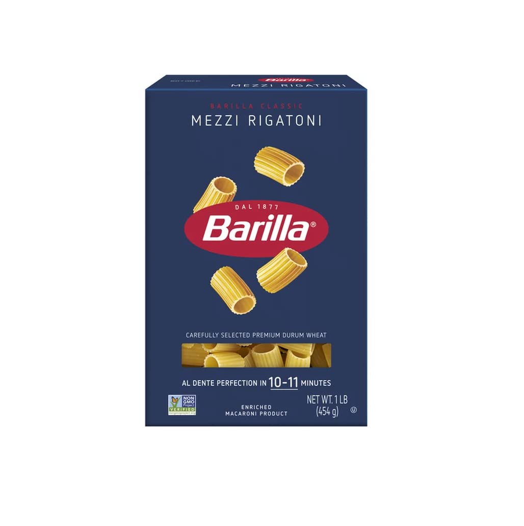 Close-up of Barilla mezzi rigatoni tubes on a surface, highlighting firm durum texture