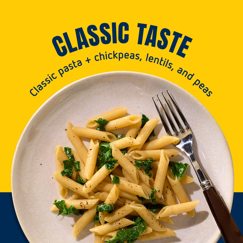 Hand holding Barilla Protein+ penne box for scale to show 14.5oz package size