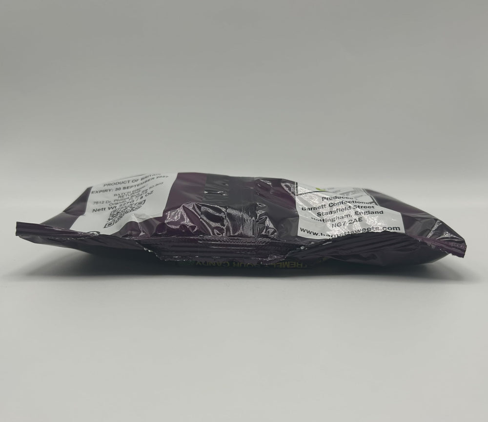 Barnetts candies held in hand to show 227g bag size and portioning