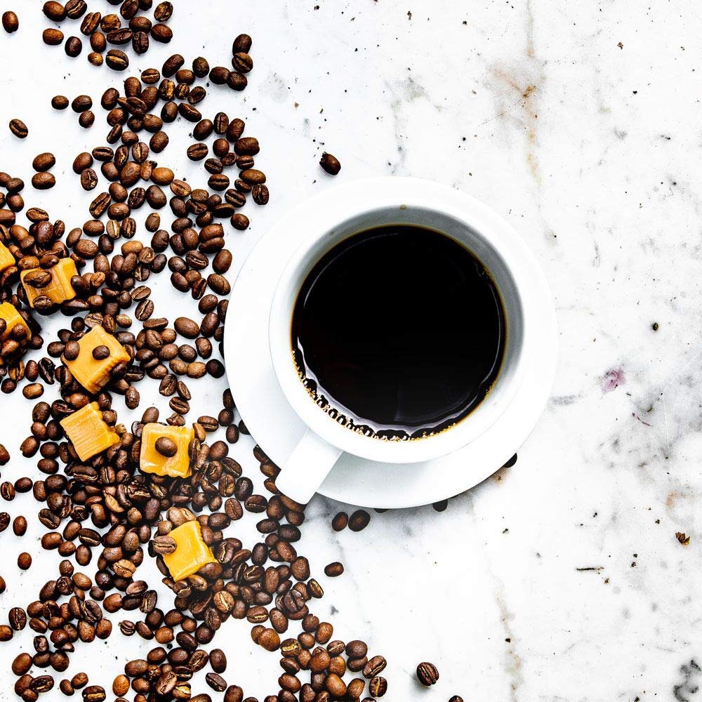 Barnie's pod in a Keurig brewer mid-brew, fast single-cup convenience