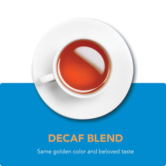 Unwrapped Barry's Tea decaf tea bags beside loose leaves showing consistent blend strength