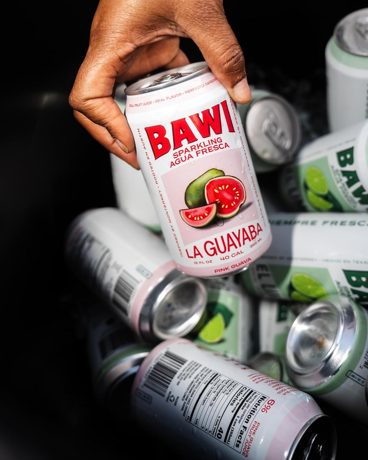 Bawi guava pouring into glass showing bubbles and bright guava flavor