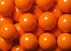 Bayside Candy orange gumballs on a party table adding bright visual impact