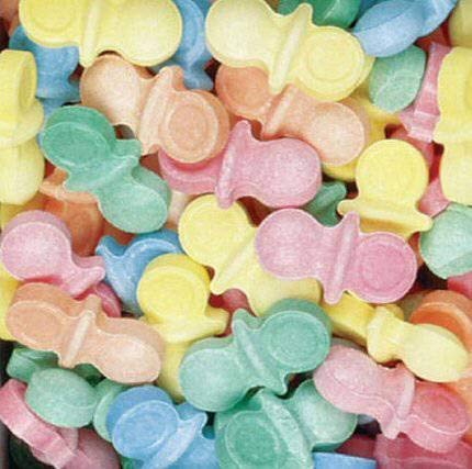 BAYSIDE CANDY close-up of uncoated pacifier candies texture, showing natural pressed finish