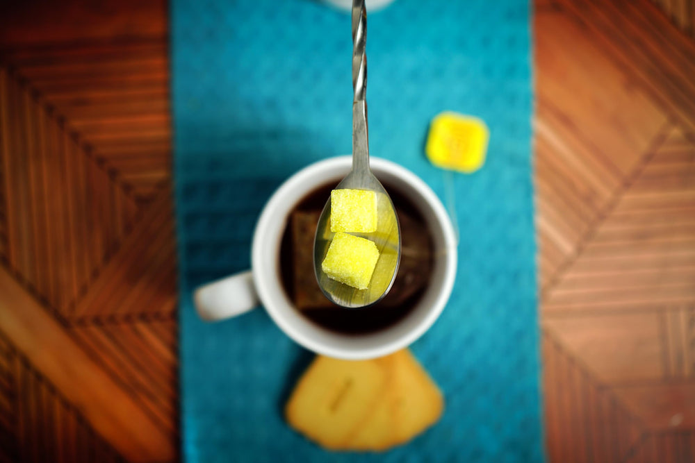 Bear Necessities jar beside teaspoon showing cube size, convenient single-serve portions