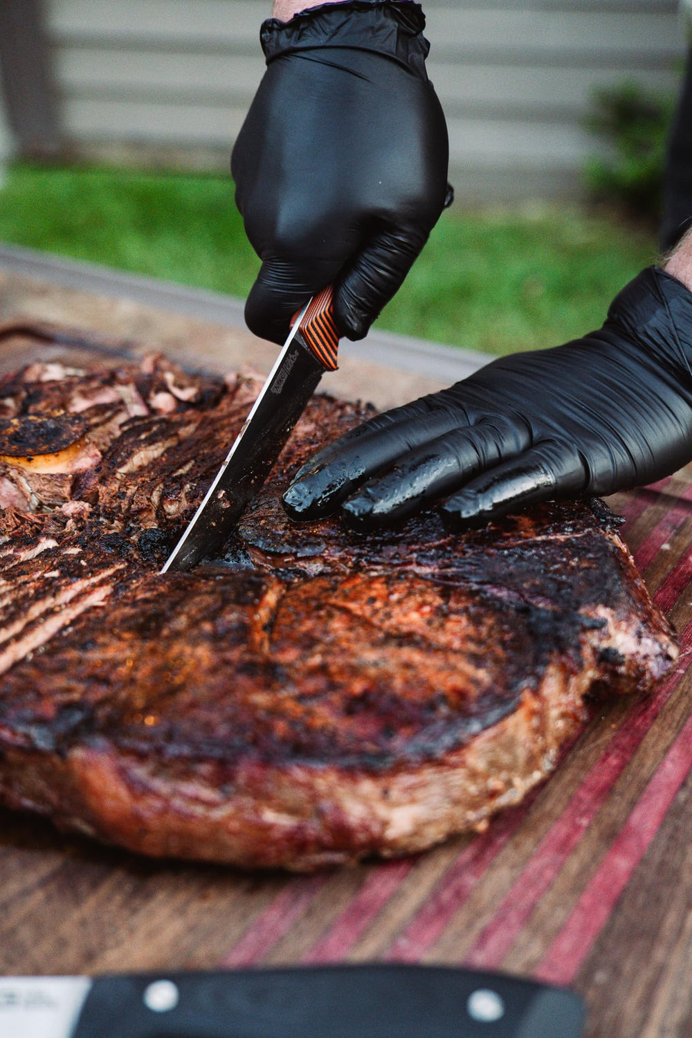 Bearded Butcher BBQ lifestyle brisket plated illustrating rich bark and flavor
