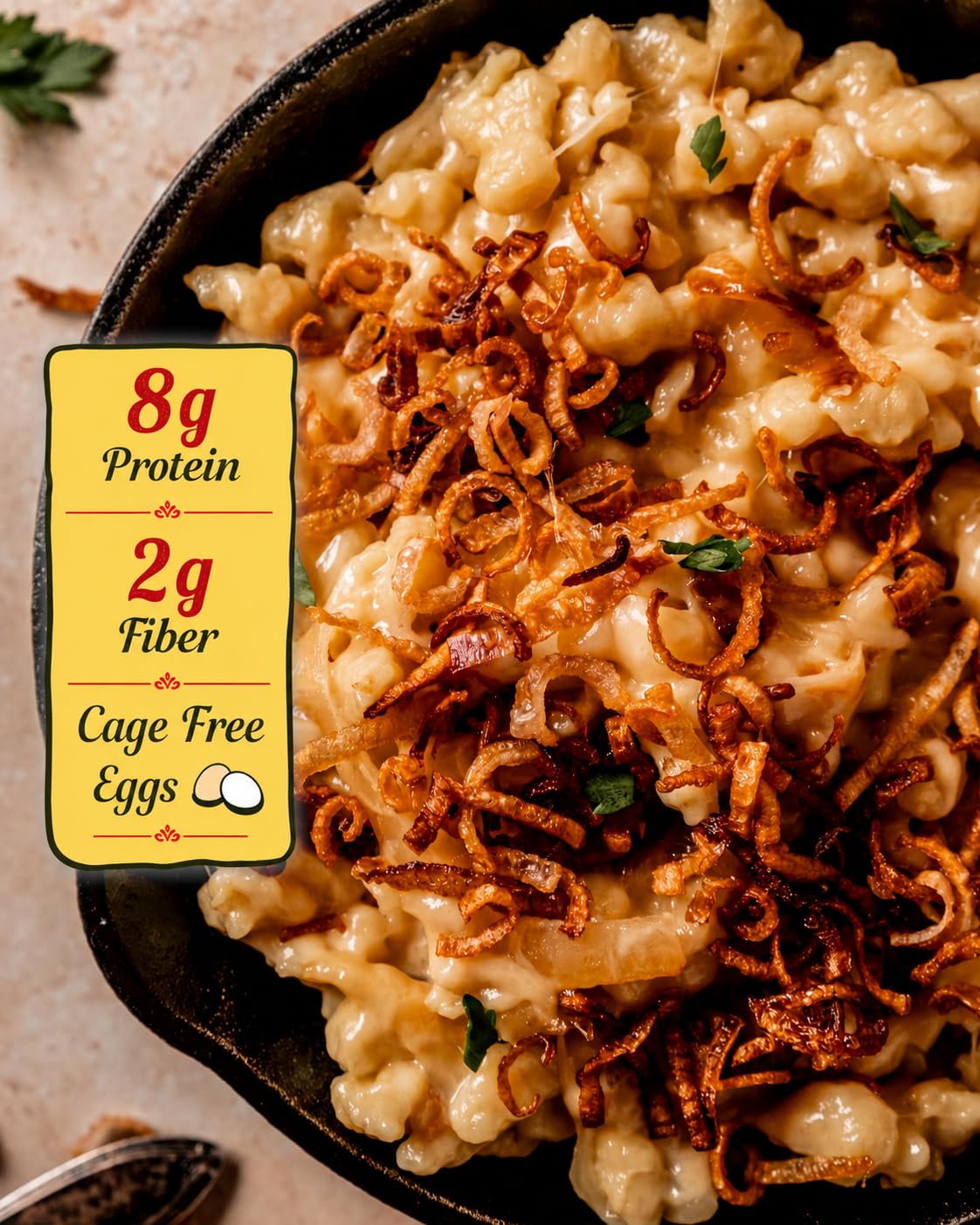 Bechtle cooked Käse‑Spaetzle plated to show creamy cheese coverage and comfort appeal
