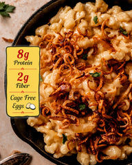 Bechtle cooked Käse‑Spaetzle plated to show creamy cheese coverage and comfort appeal
