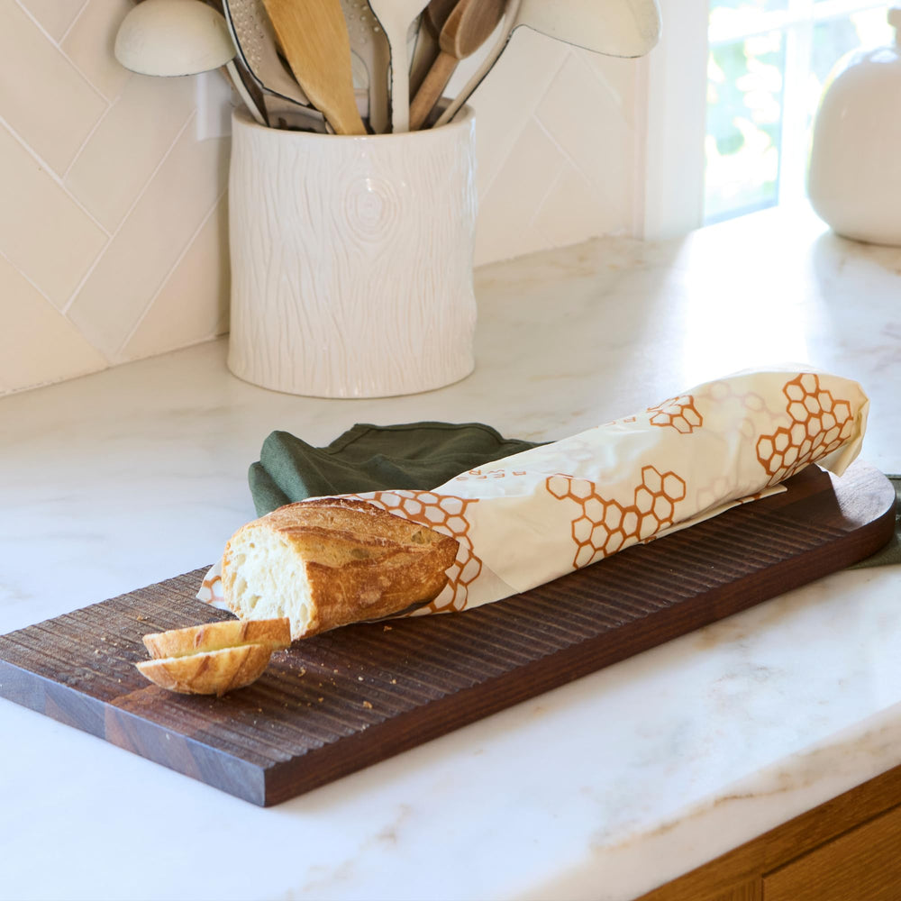 Bee's Wrap laid next to a ruler showing 17 by 23 inch size fit