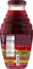 Beetology pouring into glass highlighting vibrant color and ready-to-drink freshness
