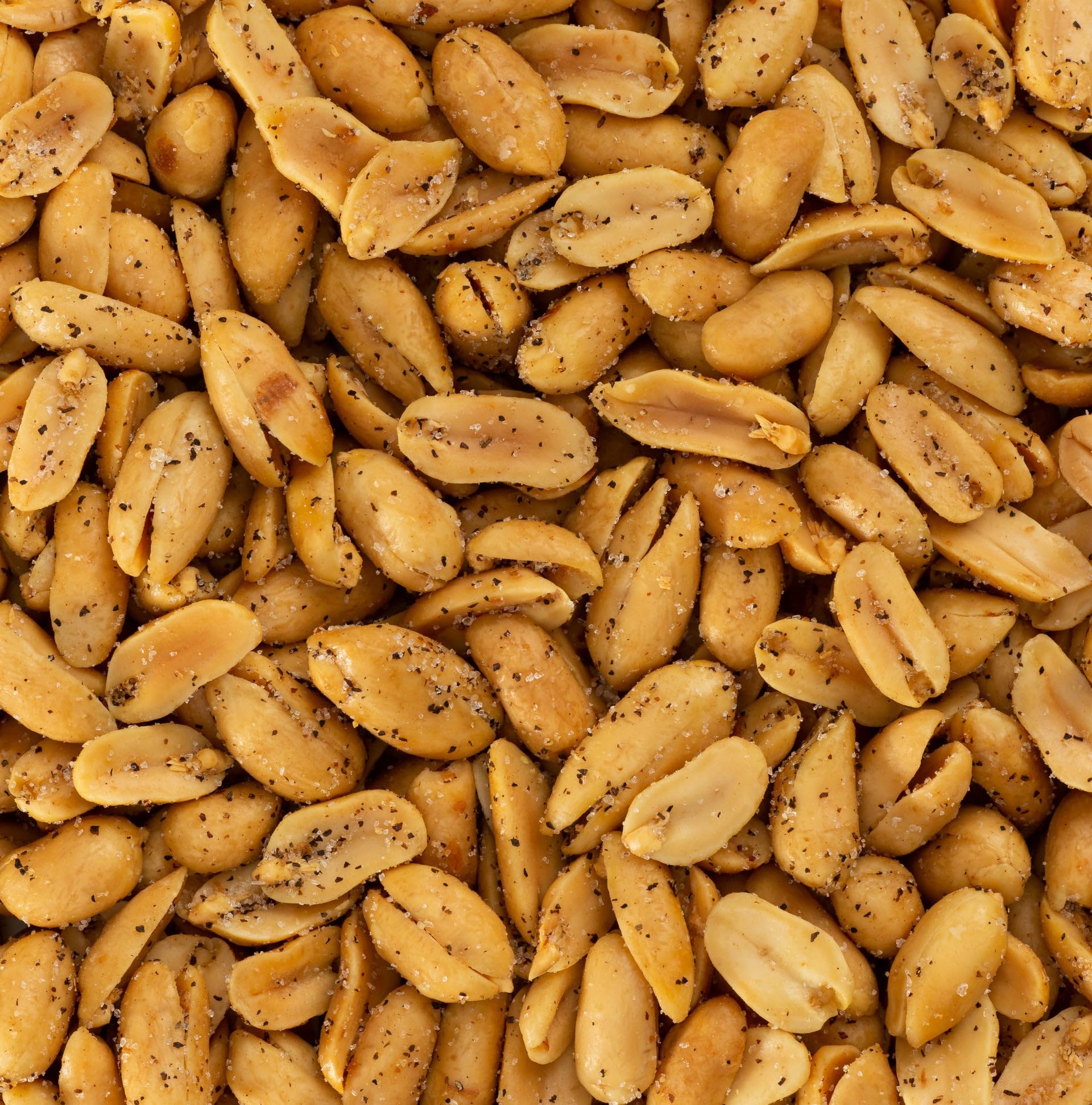 Hand holding Belmont Peanuts to show extra-large Virginia peanut size and scale