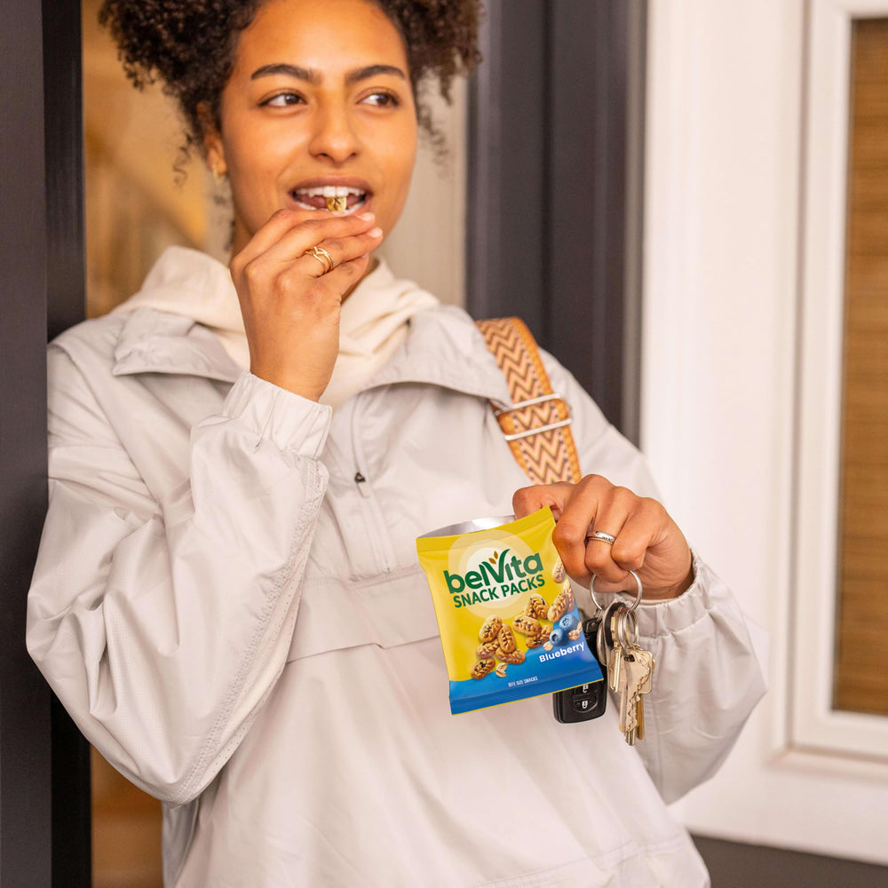 belVita bite pack held in hand showing compact, travel-friendly size