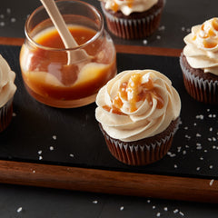 Betty Crocker open tub displaying whipped buttercream texture, smooth spreading benefit
