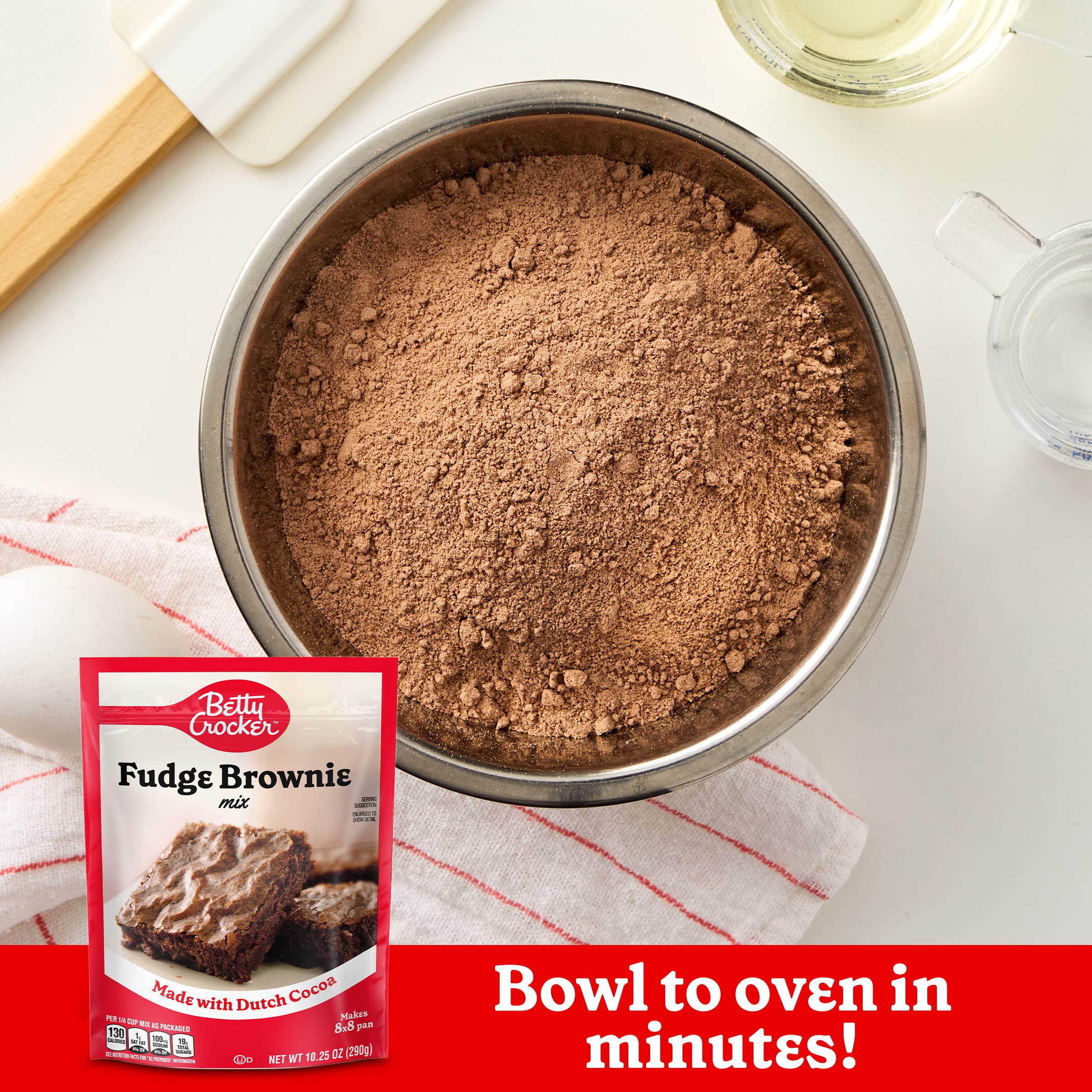 Betty Crocker pouring mixed batter into pan for fast baking