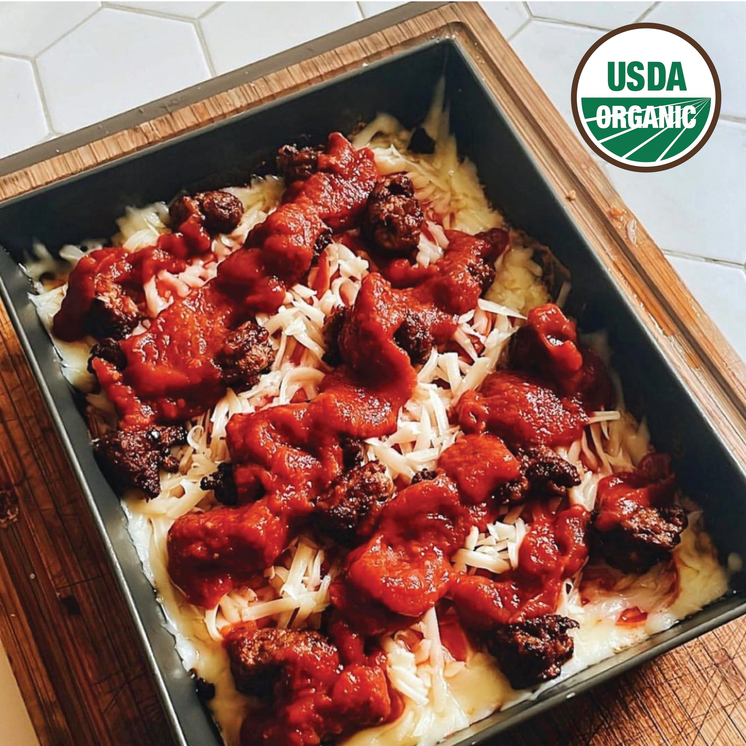 Bowl of pasta topped with Bianco DiNapoli diced tomatoes delivering bold flavor