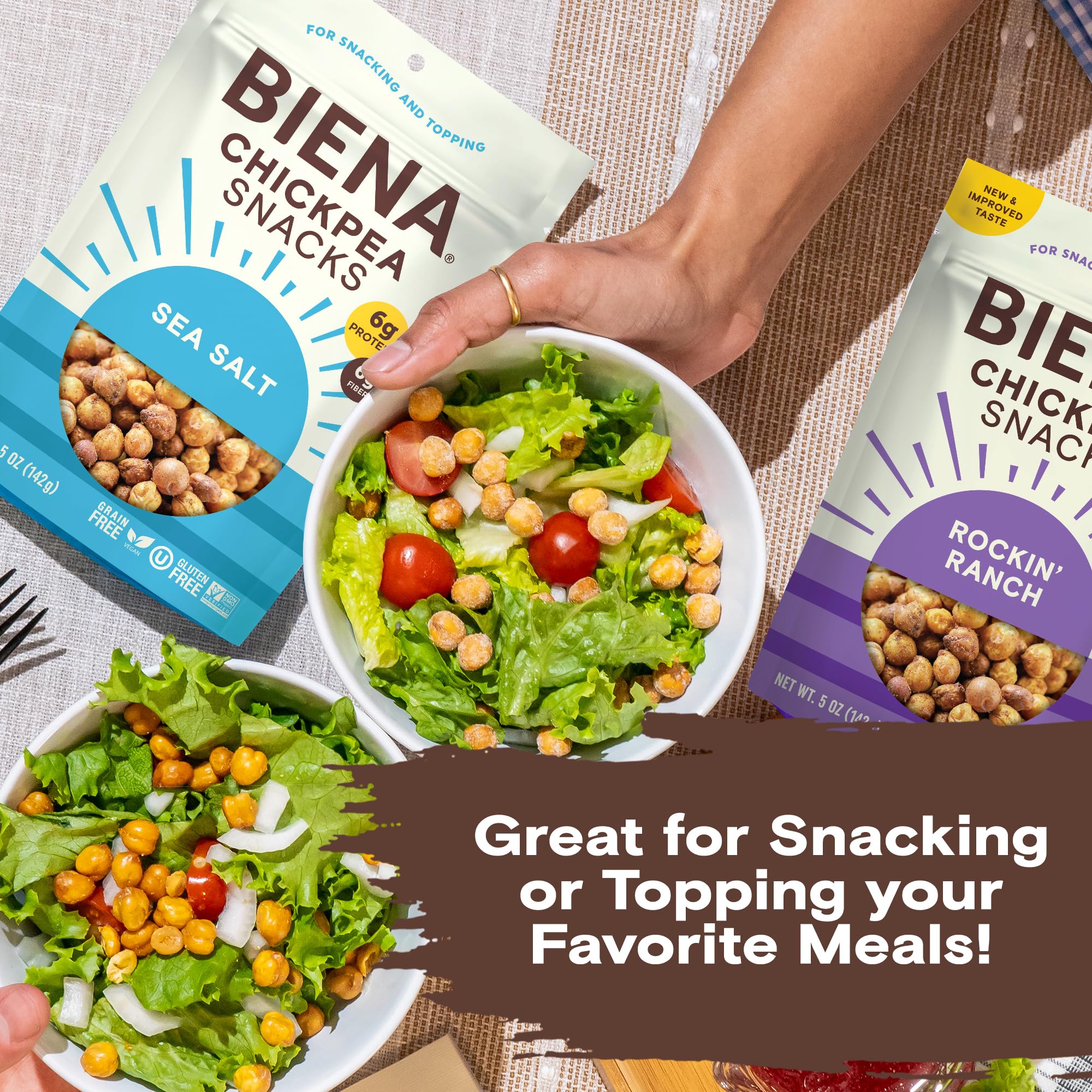 BIENA bag held next to hand showing 5 oz size and portion control benefit