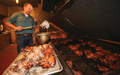 Big Bob Gibson bottle beside grilled chicken, demonstrates pairing and enhances meal appeal