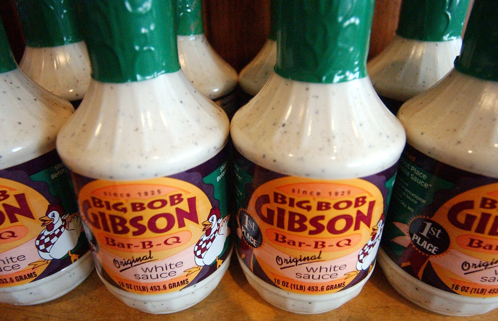 Big Bob Gibson sauce drizzle closeup over chicken, creamy texture adds bright tangy flavor