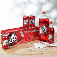 Big Red zero sugar open can being poured into glass showing refreshing pour and sparkle