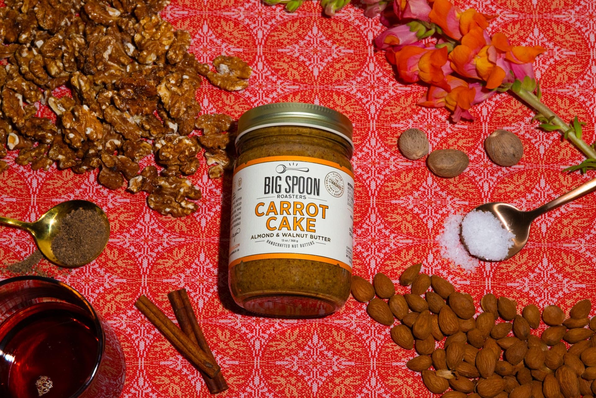 Big Spoon Roasters 13 ounce jar beside a measuring cup for scale