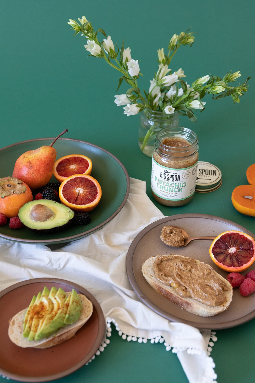 Big Spoon Roasters spread on apple slices demonstrating healthy snack pairing
