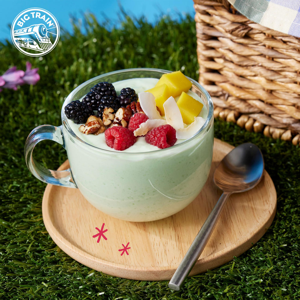 Big Train frappe beside banana and berries showing pairing versatility