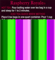Close-up of Bigelow Raspberry Royale tea bag steeping with visible raspberry-infused color
