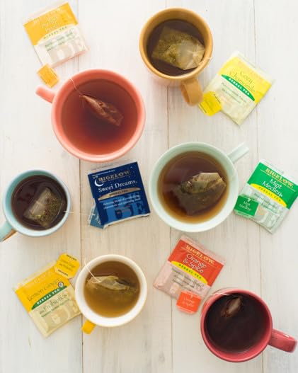 Bigelow Tea pack next to a mug and phone showing scale and portion convenience