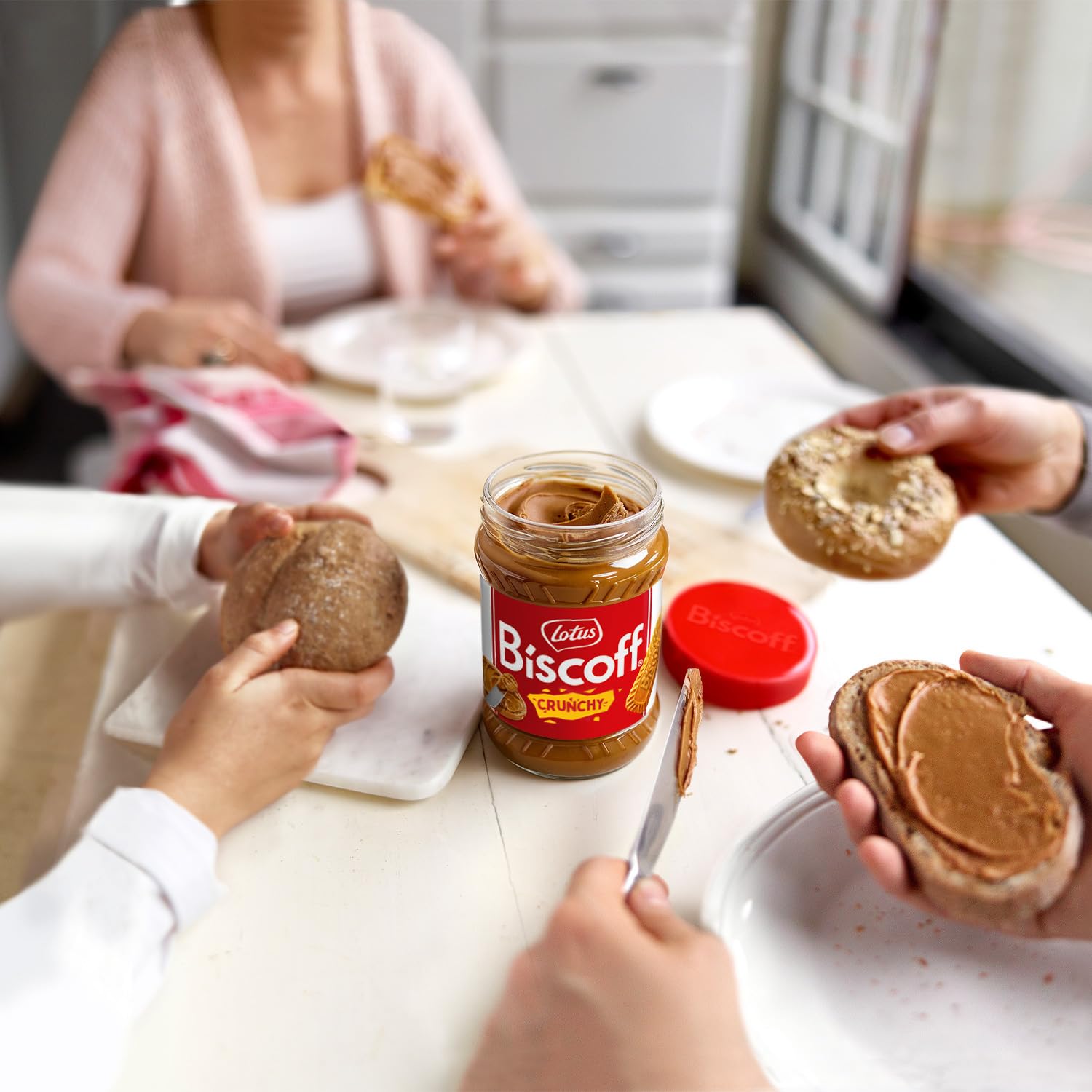Biscoff jar on a breakfast table with waffles and fruit showing serving idea