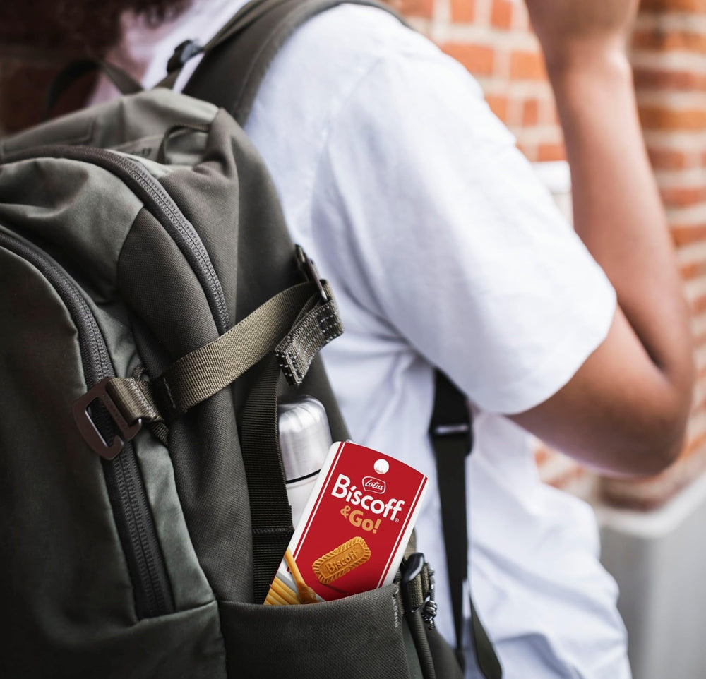 Biscoff pack next to handbag showing portability and on-the-go convenience