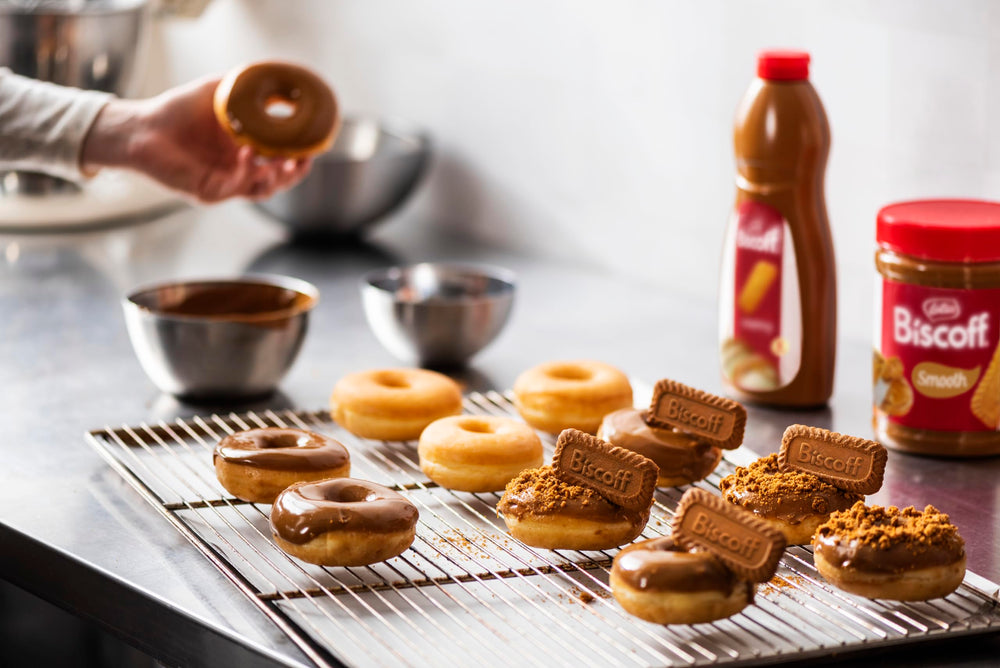 1L Biscoff bottle next to a coffee cup for scale and portion convenience