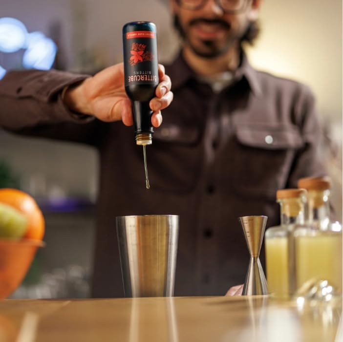 Bittercube pouring dashes into a stirred cocktail demonstrating flavor control