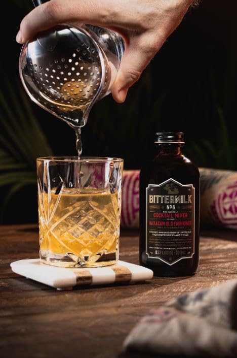 Bittermilk No.6 bottle beside a mezcal bottle demonstrating ideal spirit pairing