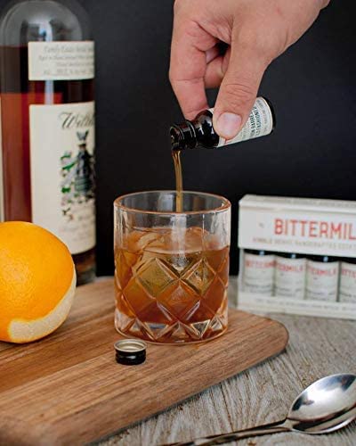 Bittermilk Old Fashioned served with an orange twist showcasing citrus aroma