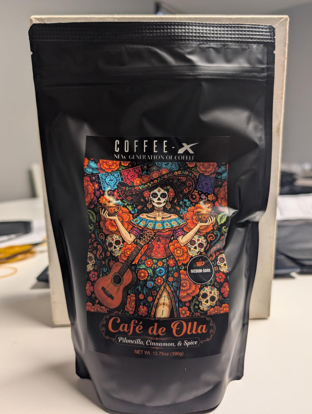 Black Drop Coffee front packaging showing Café de Olla label and warming spices benefit aroma